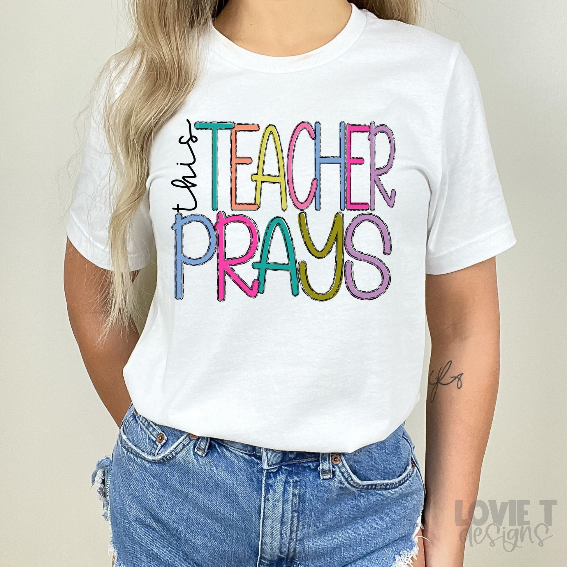 This Teacher Prays-Lovie T Designs